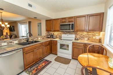 This stunning three-bedroom, two-bath, first floor villa, offers - photo 5