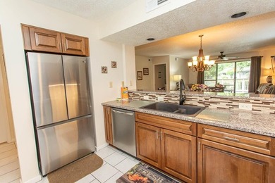 This stunning three-bedroom, two-bath, first floor villa, offers - photo 9