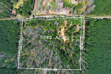 Discover 7.582 acres of unrestricted land ideally located near - photo 2