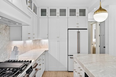 Discover the epitome of coastal luxury at 305 Elm St. in the - photo 13