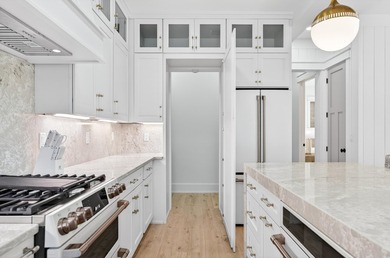 Discover the epitome of coastal luxury at 305 Elm St. in the - photo 14