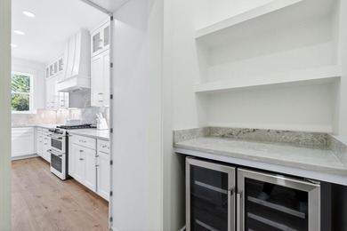 Discover the epitome of coastal luxury at 305 Elm St. in the - photo 15