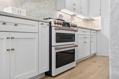 Discover the epitome of coastal luxury at 305 Elm St. in the - photo 27