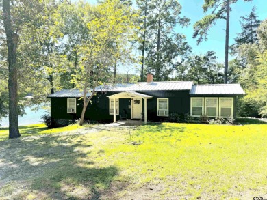 Discover the perfect getaway in this charming lake cabin on - Lake Home For Sale in Jacksonville, Texas