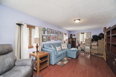 With its knotty pine wood finishes and tree shaded setting, this