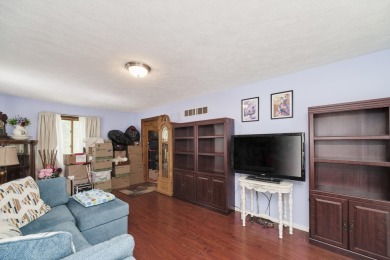 With its knotty pine wood finishes and tree shaded setting, this