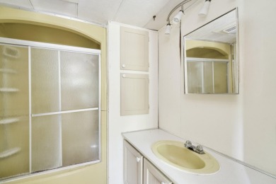 With its knotty pine wood finishes and tree shaded setting, this