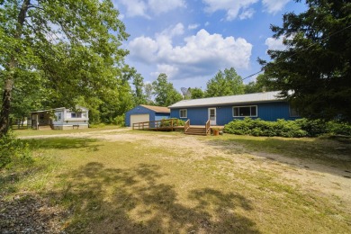 With its knotty pine wood finishes and tree shaded setting, this