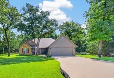 Located on three premium wooded lots in the gated community of - photo 39
