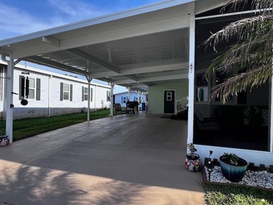 This well-maintained home features a membrane roof over the home - photo 20