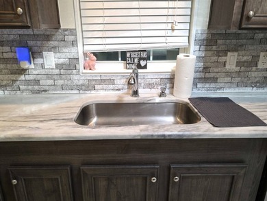 THIS HOME IS ON LEASED LAND WITH A MONTHLY LOT RENT OF $425 AND - photo 22