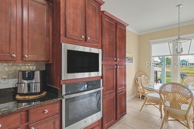Set on a large premium lot with peaceful lagoon views, timeless - photo 11