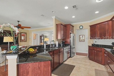 Set on a large premium lot with peaceful lagoon views, timeless - photo 13