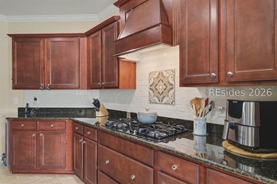Set on a large premium lot with peaceful lagoon views, timeless - photo 14