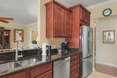 Set on a large premium lot with peaceful lagoon views, timeless - photo 15