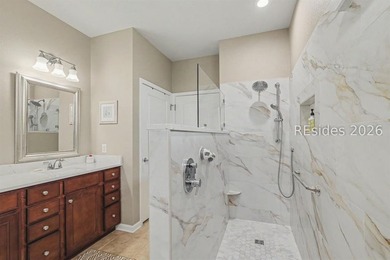 Set on a large premium lot with peaceful lagoon views, timeless - photo 18