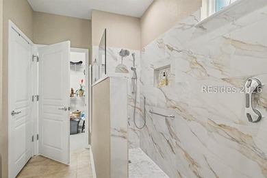 Set on a large premium lot with peaceful lagoon views, timeless - photo 20