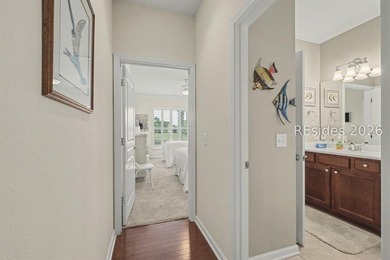 Set on a large premium lot with peaceful lagoon views, timeless - photo 21