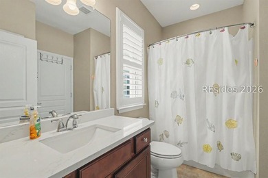 Set on a large premium lot with peaceful lagoon views, timeless - photo 24