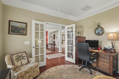 Set on a large premium lot with peaceful lagoon views, timeless - photo 26
