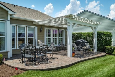 Set on a large premium lot with peaceful lagoon views, timeless - photo 29