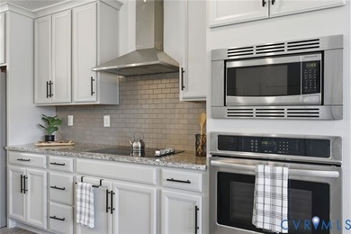 This beautifully designed two-story townhome style condo with a - photo 3