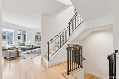 This gorgeous, light-filled home with wood floors throughout - photo 6