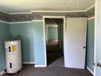 FIXER UPPER. The metal roof appears to be newer, and the - photo 22
