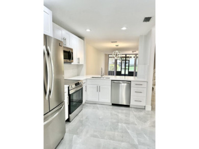 Lake Townhome/Townhouse For Sale in Coconut Creek, Florida