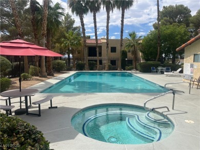 DISCOVER THIS BEAUTIFULLY UPDATED FIRST-FLOOR CONDO, IDEALLY