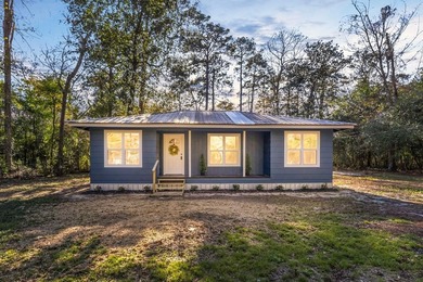 Discover your newly remodeled retreat in the coveted *Land of - photo 2