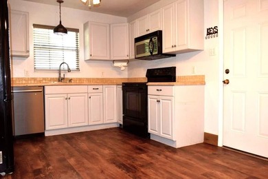Welcome home to this delightful 3-bedroom, 2-bath cottage-style - photo 12