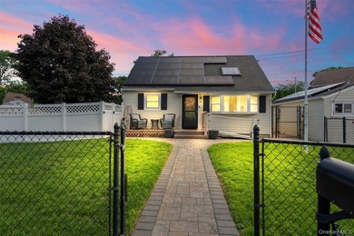 Charming and well-maintained 3-bedroom, 1-bath Cape nestled on a - photo 1