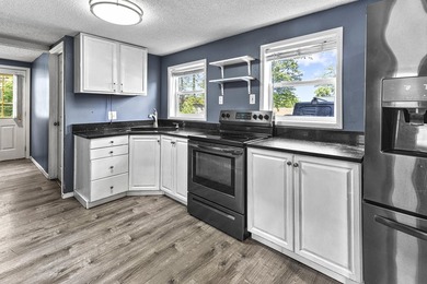 Wake up to beautiful views of Houghton Lake from the spacious - photo 14