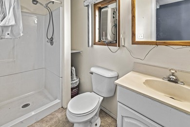 Wake up to beautiful views of Houghton Lake from the spacious - photo 21