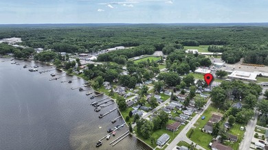 Wake up to beautiful views of Houghton Lake from the spacious - photo 39
