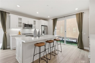 The open-concept floor plan showcases impressive 10-foot - photo 14