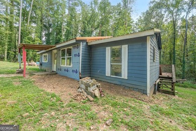 Investor special near Lake Allatoona! This single-story home on - photo 2