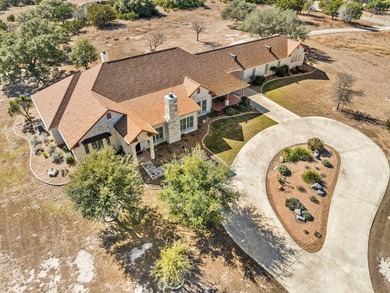 This sprawling one-story custom stone home sits on 4.33 acres of