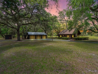 Tucked away behind a beautiful board-fenced entrance and paved - photo 1