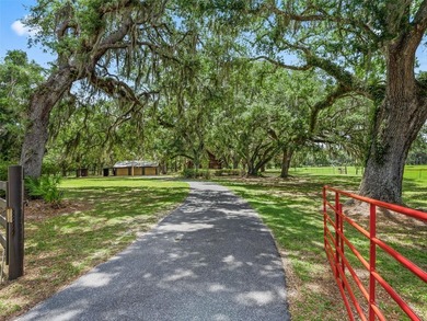 Tucked away behind a beautiful board-fenced entrance and paved - photo 4