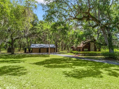 Tucked away behind a beautiful board-fenced entrance and paved - photo 5