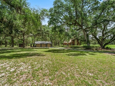 Tucked away behind a beautiful board-fenced entrance and paved - photo 6