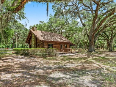 Tucked away behind a beautiful board-fenced entrance and paved - photo 8