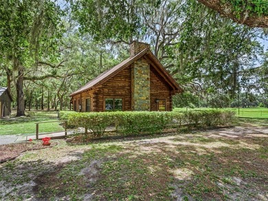Tucked away behind a beautiful board-fenced entrance and paved - photo 9