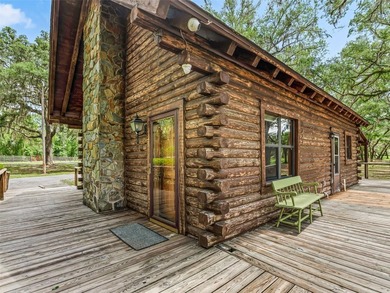 Tucked away behind a beautiful board-fenced entrance and paved - photo 10