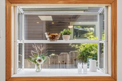 Bright and airy, this freshly upgraded home fills with beautiful - photo 12
