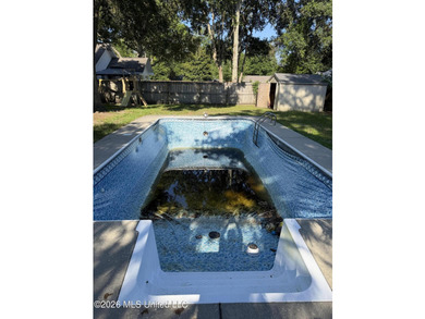This charming home features a fenced backyard with a saltwater - photo 25