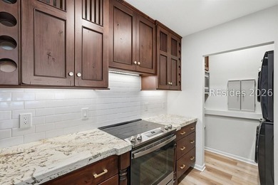 Extensively renovated in 2023, this second-floor end unit offers - photo 11