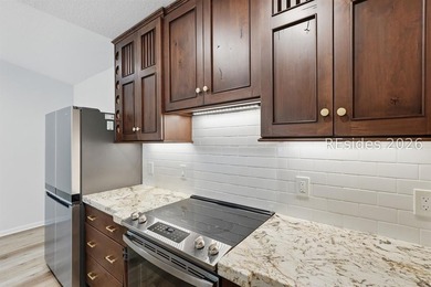 Extensively renovated in 2023, this second-floor end unit offers - photo 12